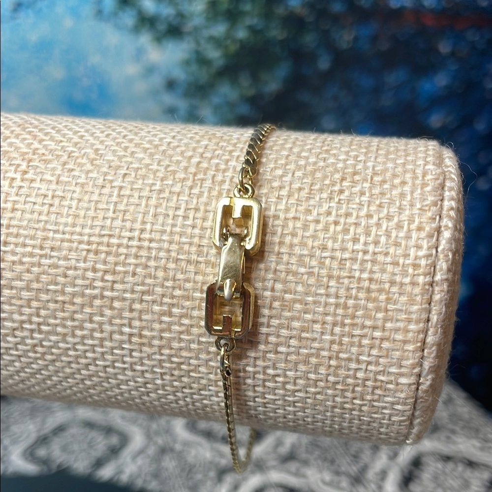 Givenchy Gold Zipper Design Bracelet with Double G clasp. Seven inches.